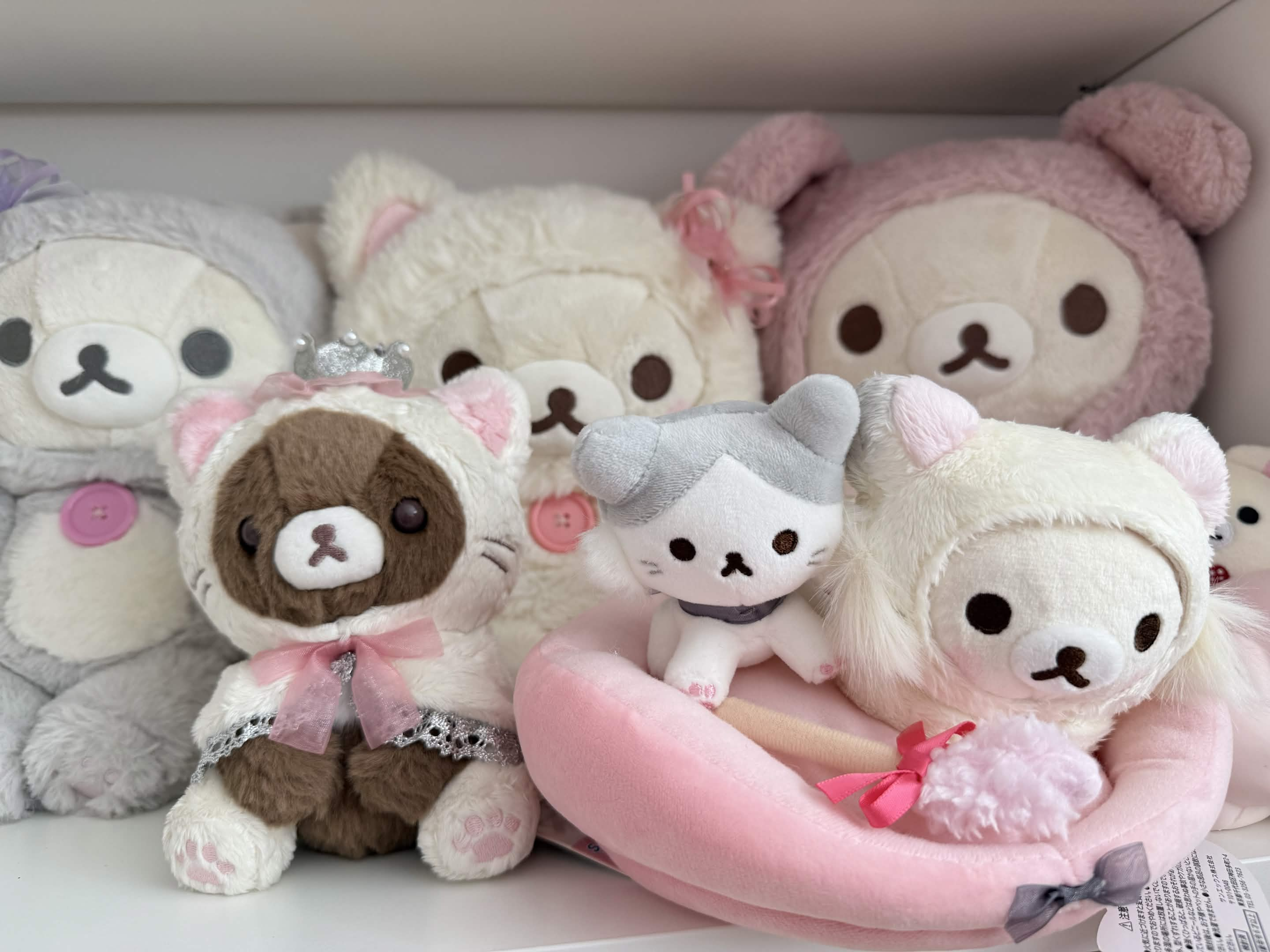 Plushies against an anime backdrop