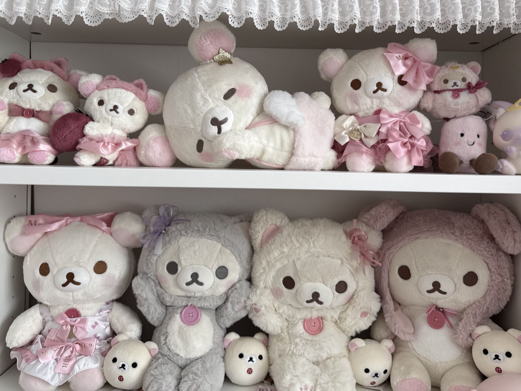 Plushie lying down with others behind